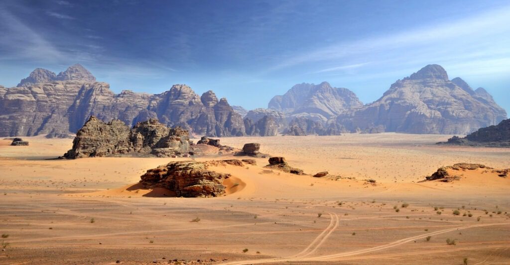 Jordan Tours in Wadi Rum featuring red desert landscapes and mountain formations