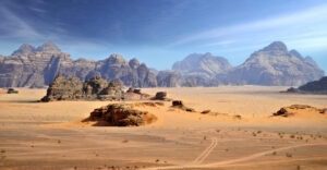 Jordan Tours in Wadi Rum featuring red desert landscapes and mountain formations