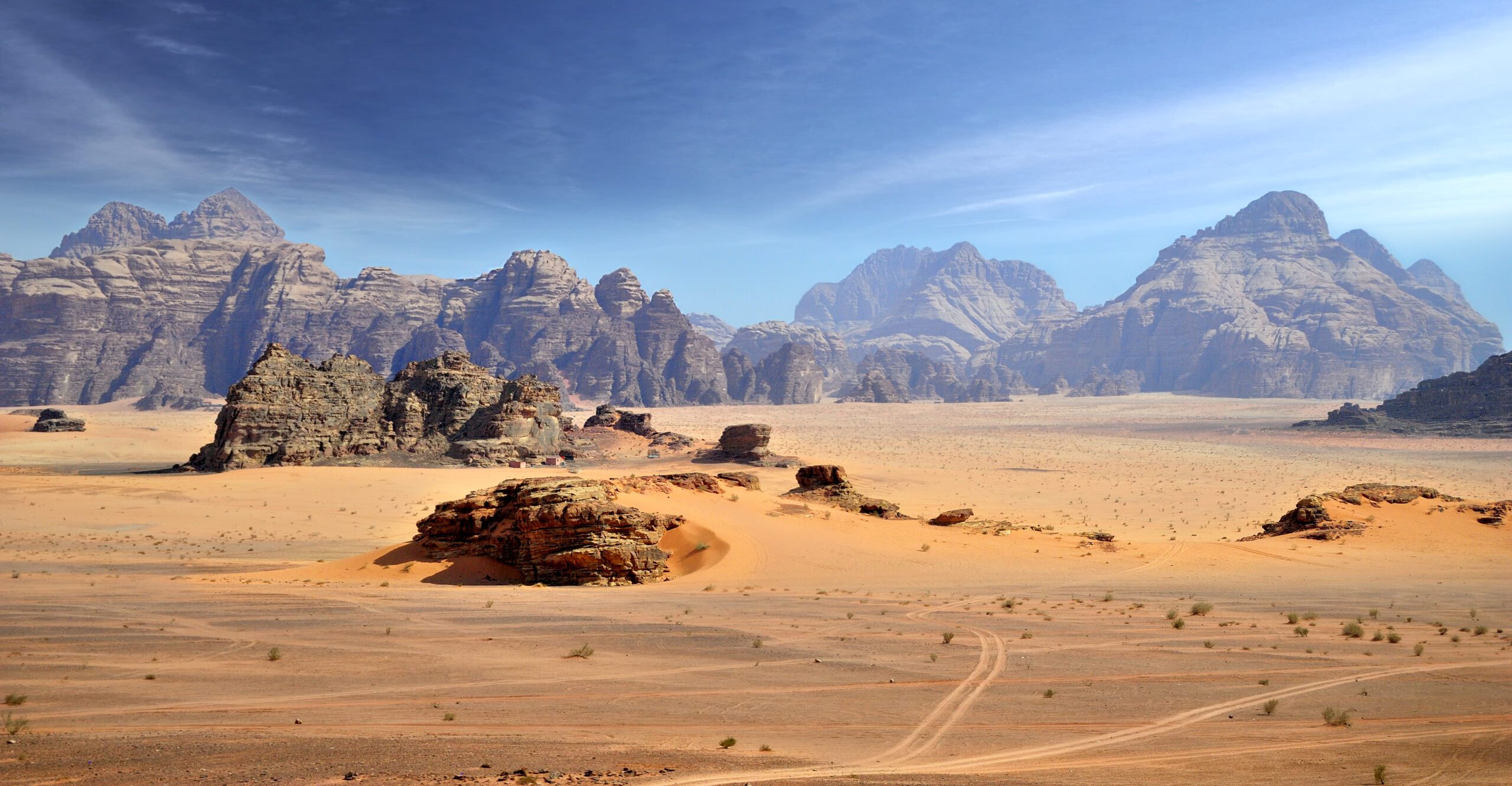 Jordan Tours in Wadi Rum featuring red desert landscapes and mountain formations