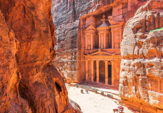 Petra Treasury viewed through the sandstone cliffs in Jordan